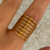 GOLD FLORA CAGED STEEL ring