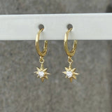 GOLD CRYSTAL STARBURST DANGLE HUGGIE earrings