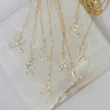 GOLD CURSIVE INITIAL PEARL MINI necklace