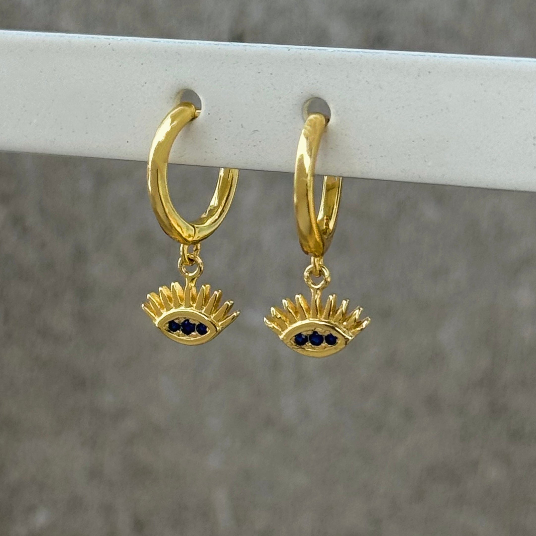 GOLD EYE HUGGIE HOOP earrings