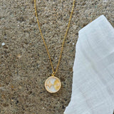 GOLD STARBURST MOTHER OF PEARL necklace