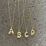 GOLD GROOVY INITAL necklace