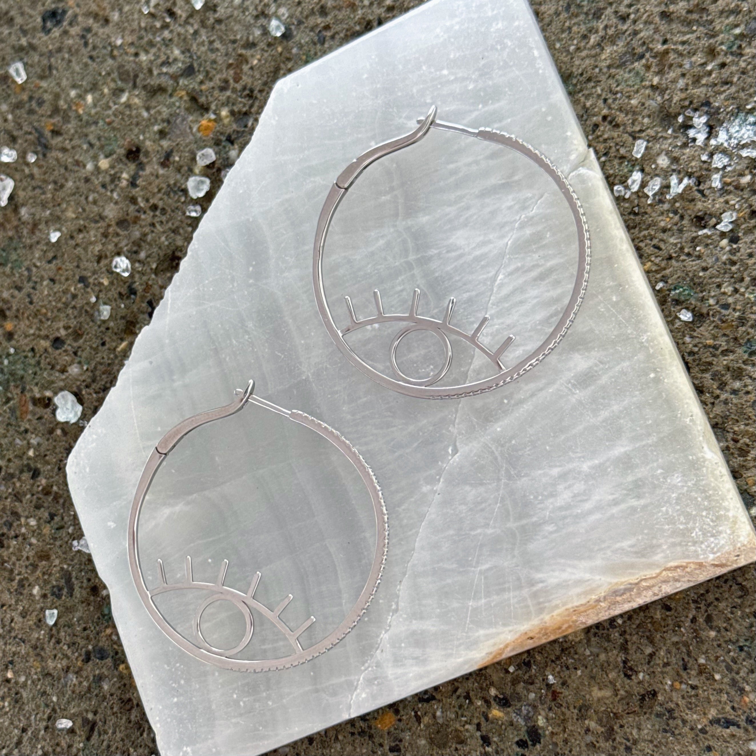 SILVER ABSTRACT EYE HOOP earrings