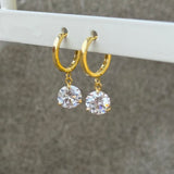 GOLD ROUND CRYSTAL DANGLE HUGGIE earrings