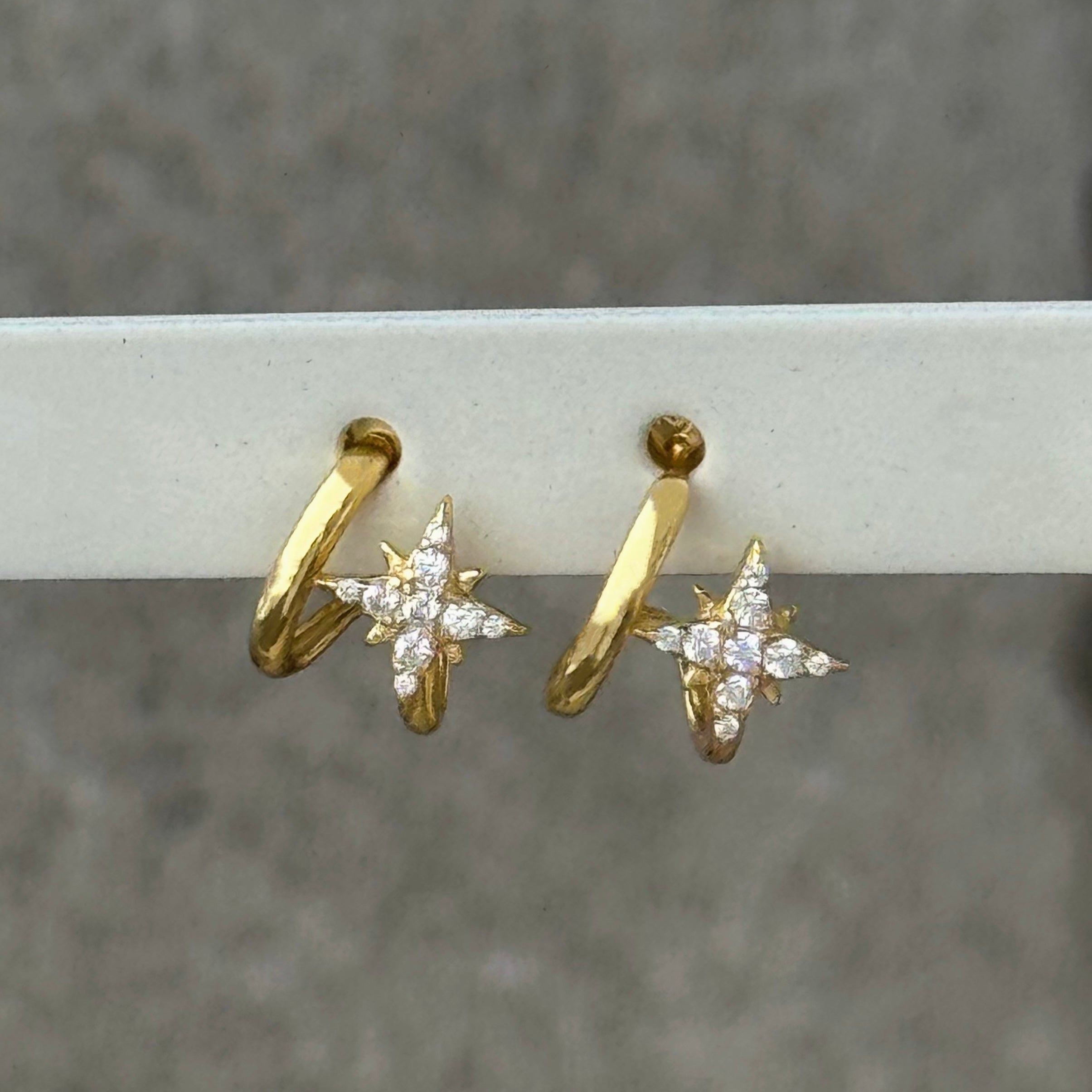 GOLD CRYSTAL STARBURST HUGGIE STUD earrings