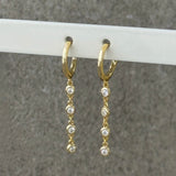 GOLD CRYSTAL BEZEL DANGLE HUGGIE earrings