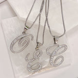 SILVER CURSIVE INITIAL STEEL necklace